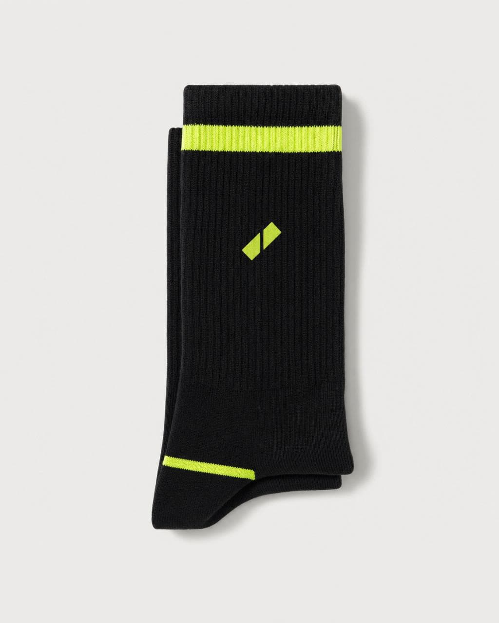 Black Blokhaus crew socks with lime toe stripe, shot on white